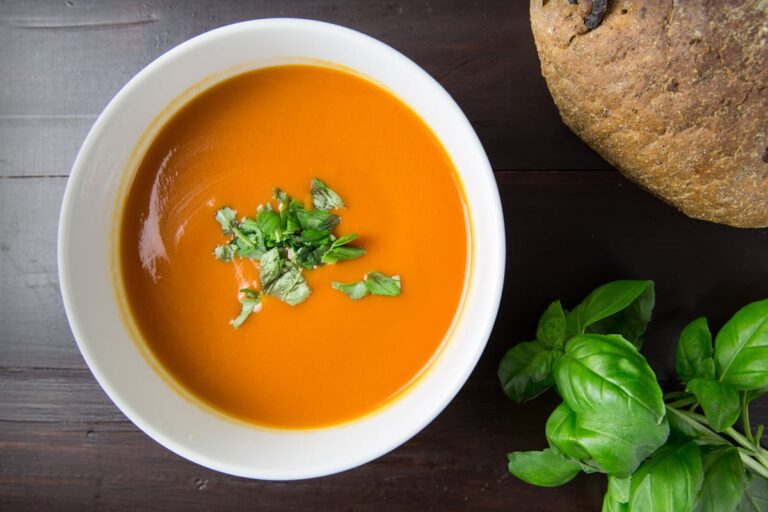 Creamy roasted tomato basil soup in a bowl